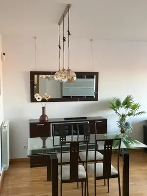 a dining room with a glass table and chairs at Fantastic apartment in Barberà in Barbera del Valles
