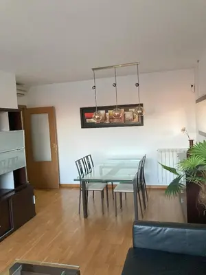 a dining room with a glass table and chairs at Fantastic apartment in Barberà in Barbera del Valles