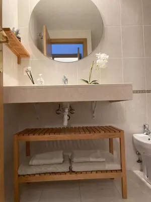 a bathroom with a sink and a mirror at Fantastic apartment in Barberà in Barbera del Valles