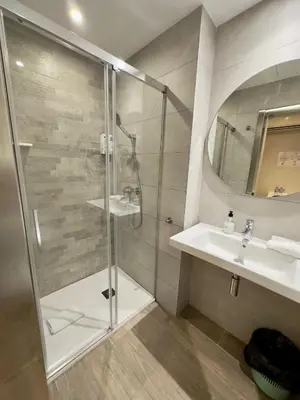 a bathroom with a shower and a sink at Standbyme Ramblas in Barcelona