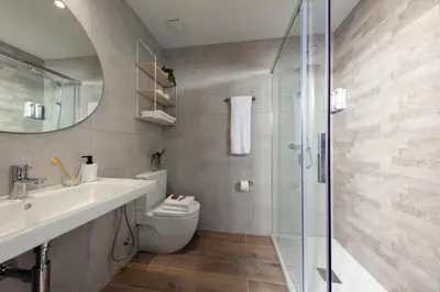 a bathroom with a toilet and a sink and a shower at Standbyme Ramblas in Barcelona