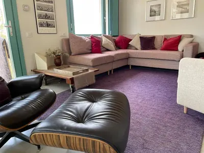 a living room with a couch and a table at Independent duplex in a stately villa in Sant Cugat del Vallès