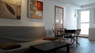 a living room with a couch and a table at Fasten in Barcelona