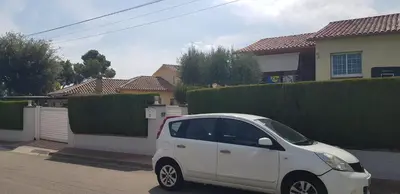 a white car parked in front of a house at Tranquilidad y Privacidad in Cánoves