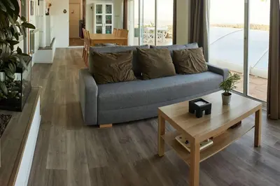 a living room with a couch and a table at Casa en Sierra Collserola in Sant Cugat del Vallès
