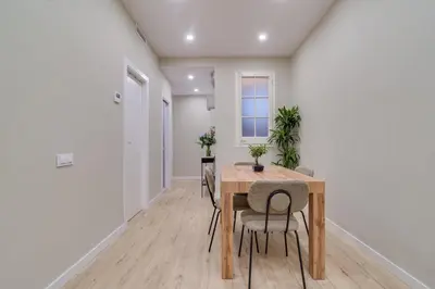 a dining room with a wooden table and chairs at GuestReady- Lovely apartment in Barcelona in Barcelona