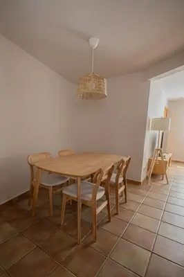 a dining room with a wooden table and chairs at Estudio con encanto en Barcelona in Barcelona