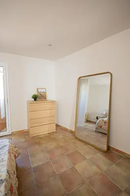 a room with a mirror and a dresser in it at Estudio con encanto en Barcelona in Barcelona