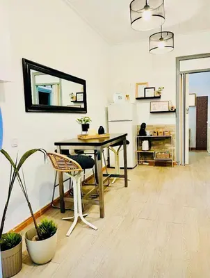 a dining room with a table and a mirror at Basic interior Apartment Sagrada Familia Excellent for exploring Barcelona Very good location in Barcelona