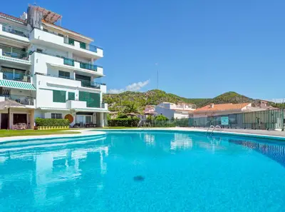 a large swimming pool in front of a building at Horizon Views by Hello Homes Sitges in Sitges