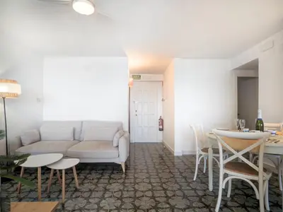 a living room with a couch and a table at Horizon Views by Hello Homes Sitges in Sitges
