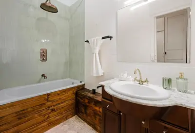 a bathroom with a walk in shower and a tub at Pet-Friendly Monthly 1BR in Central BCN in Barcelona
