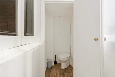 a hallway with a table and a mirror on the wall at Pet-Friendly Monthly 1BR in Central BCN in Barcelona