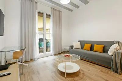 a bathroom with a sink and a bath tub and a mirror at Pet-Friendly Monthly 1BR in Central BCN in Barcelona
