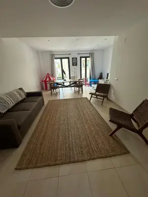 a living room with a couch and a table at Lilli apartment in Sitges