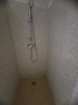 a shower with a shower head in a bathroom at Industrial loft in Eixample near Sagrada familia in Barcelona