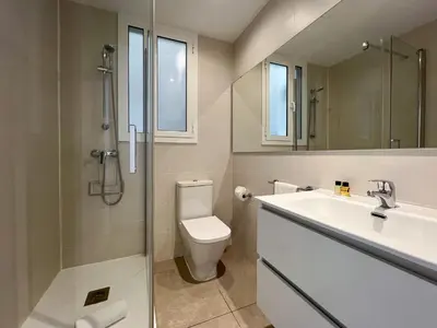 a bathroom with a toilet and a sink and a shower at Stay U-nique Apartments Balmes III in Barcelona