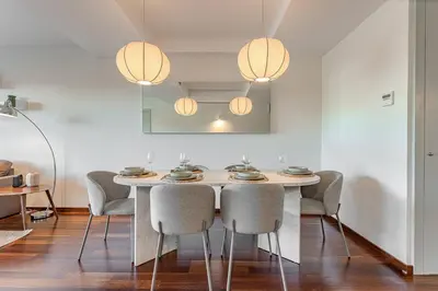 a dining room with a table and chairs at Beachside apartment in Barcelona