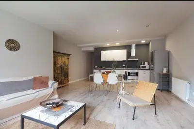 a living room with a couch and a table at Diagonal Avenue Apartment in Barcelona
