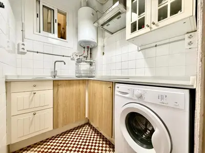 a laundry room with a washer and dryer at Bright 3 Bedroom Apartment Central Barcelona in Barcelona