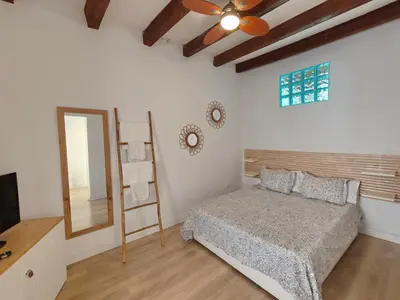 a bedroom with a bed and a mirror at Elegant apartment Sagrada Familia in Barcelona