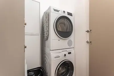 two washing machines and a washer and dryer in a room at Amplio Apartamento en Barcelona in Barcelona