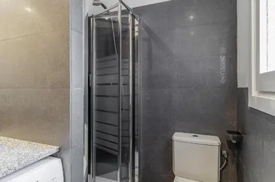 a bathroom with a toilet and a glass shower at 4329 - AB Eixample Centric in Barcelona