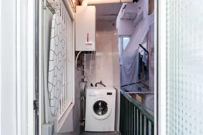 a laundry room with a washing machine in it at Homenfun Barcelona Los Bunkers in Barcelona