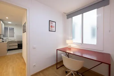 a home office with a desk and a chair at Stay U-nique Apartment Castanyer II in Barcelona