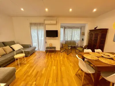 a living room with a couch and a table at Practical, 3 double bedrooms, 7' Sagrada Familia in Barcelona