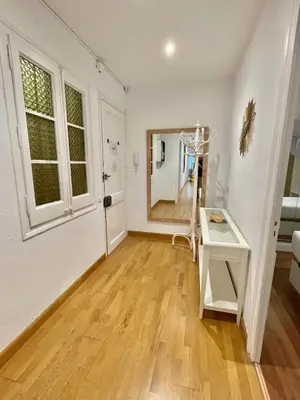 a white room with a table and a window at Practical, 3 double bedrooms, 7' Sagrada Familia in Barcelona