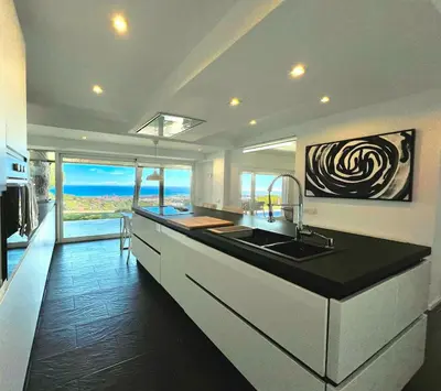 a kitchen with a sink and a counter top at Casanova, villa with Barcelona's skyline in Cabrils