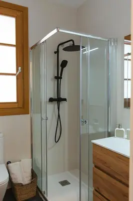 a shower in a bathroom with a glass shower stall at Barcelona - Gracia P-A in Barcelona