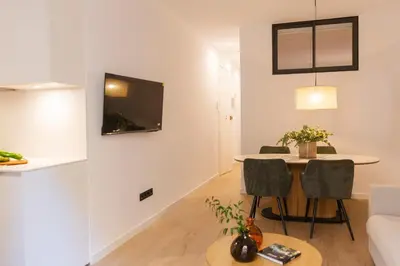 a living room with a table and a couch at Barcelona - Gracia P-B in Barcelona