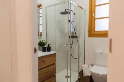 a bathroom with a glass shower and a toilet at Barcelona - Gracia P-B in Barcelona