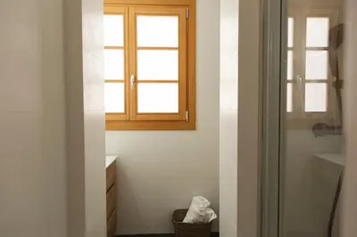 a bathroom with a window and a sink at Barcelona - Gracia 1-A in Barcelona