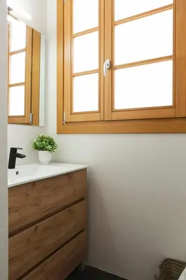 a bathroom with a sink and a mirror at Barcelona - Gracia 1-A in Barcelona