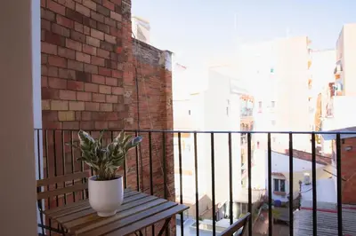 a potted plant sitting on a table on a balcony at Barcelona - Gracia 2-A in Barcelona