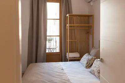 a bedroom with a bed and a window at Barcelona - Gracia 2-A in Barcelona