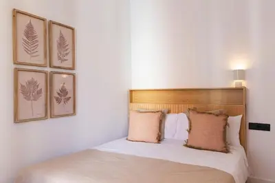 a bedroom with a bed with two pillows on it at Barcelona - Gracia 2-B in Barcelona