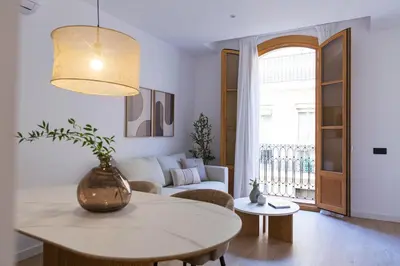 a living room with a table and a couch at Barcelona - Gracia 2-B in Barcelona