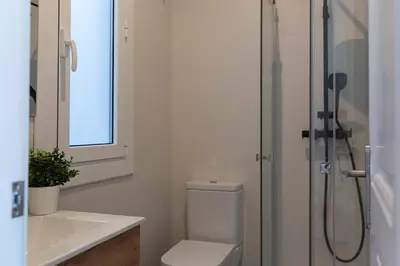 a bathroom with a shower and a toilet and a sink at Barcelona - Gracia 4-A in Barcelona