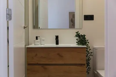 a bathroom with a sink and a mirror at Barcelona - Gracia 5-A in Barcelona