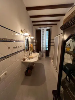a collage of three pictures of a bathroom at Habitaciónes en casa exclusiva en Centelles in Centellas