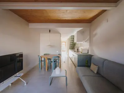 a bedroom with a bed and a desk in a room at Casa Flor Boutique Mid-term Monthly Rentals in Barcelona