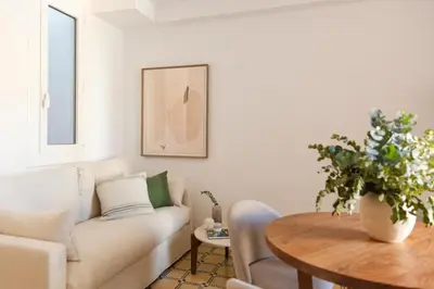 a living room with a couch and a table at Barcelona - Gracia 3-A in Barcelona