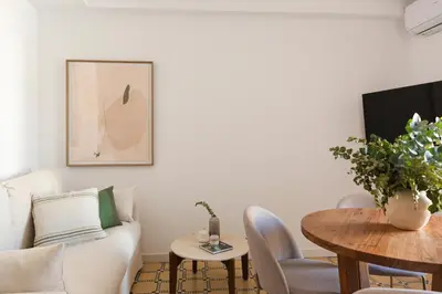 a living room with a white couch and a table at Barcelona - Gracia 3-A in Barcelona