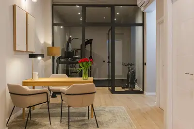 a dining room with a table and some chairs at Barcelona - Gracia 3-B in Barcelona