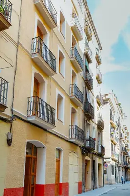 a building with balconies on the side of a street at Barcelona - Gracia 3-B in Barcelona