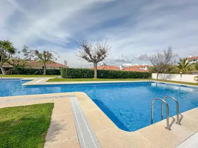 a swimming pool in a yard with trees and bushes at Balmins Vibes by Hello Homes Sitges in Sitges
